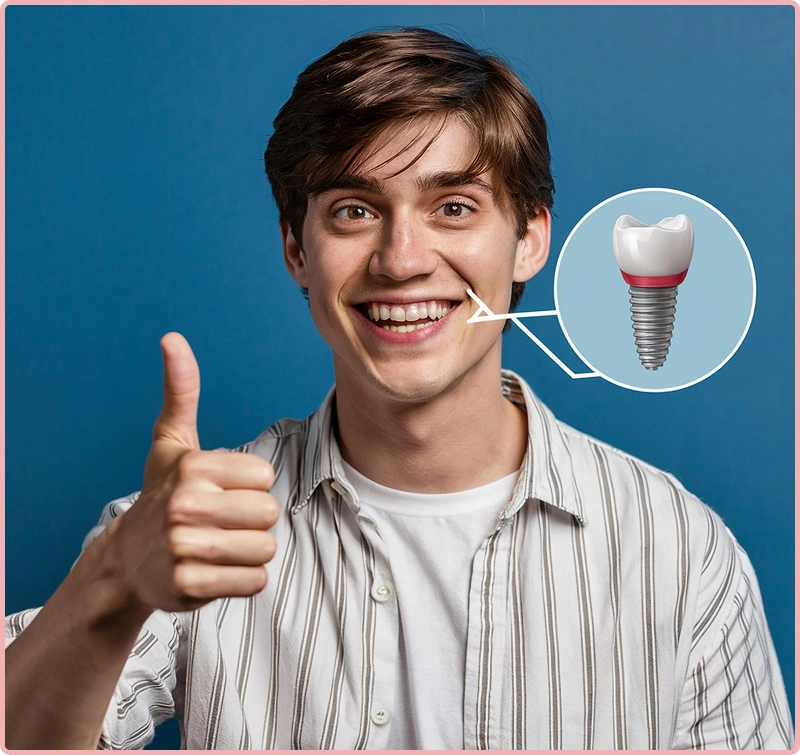 Smiling person holding a dental implant model
                                showing a metal implant with a crown.